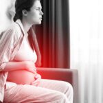 Pregnant woman at home feels sick. Different health problems during pregnancy.