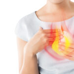 Woman Suffering From Acid Reflux Or Heartburn-Isolated On White Background