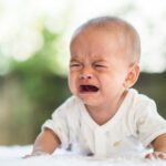 Baby boy crying. Sad child portrait