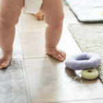 Closeup of baby's legs while standing